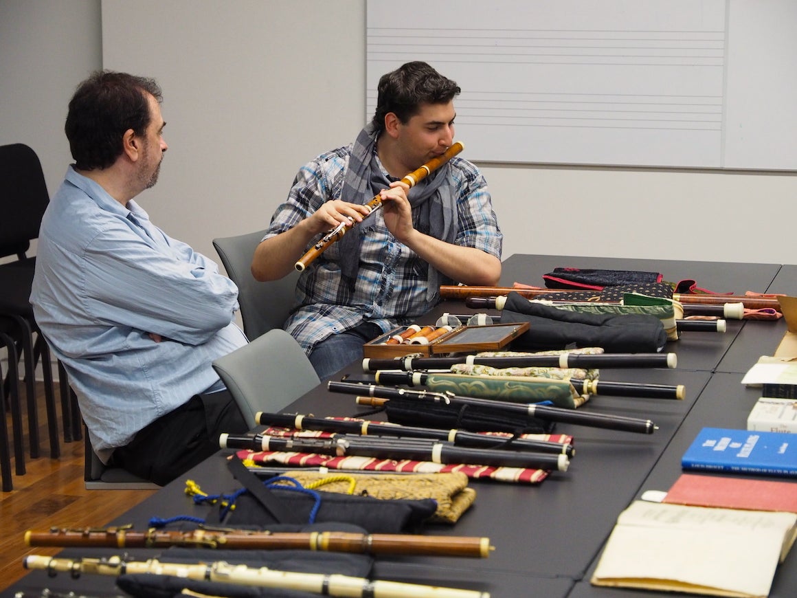 student playing a baroque flute