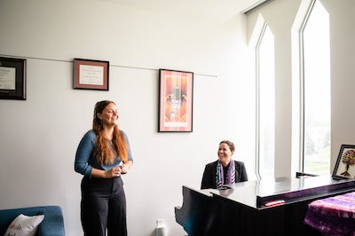 Kreucher laughs with Katherine Jolly during a lesson