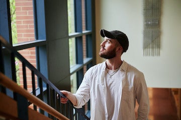 A student in a stairwell.