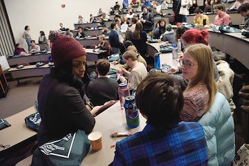 Small group discussions in a lecture hall.
