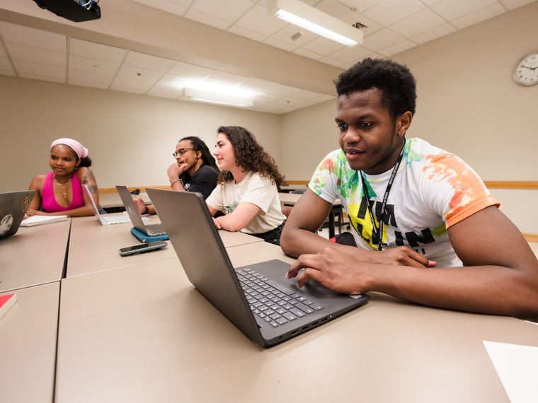 Students at a classroom table.