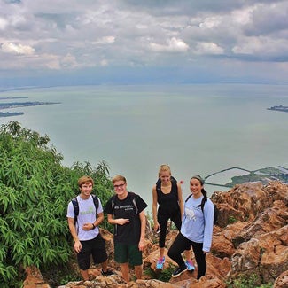 Four students at a scenic overlook