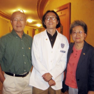 Three people, one wearing a lab coat
