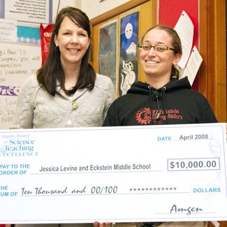 Jessica receives a huge, ceremonial check for $10,000