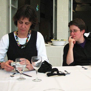Ryan at a dinner table with Barbara Sawhill.