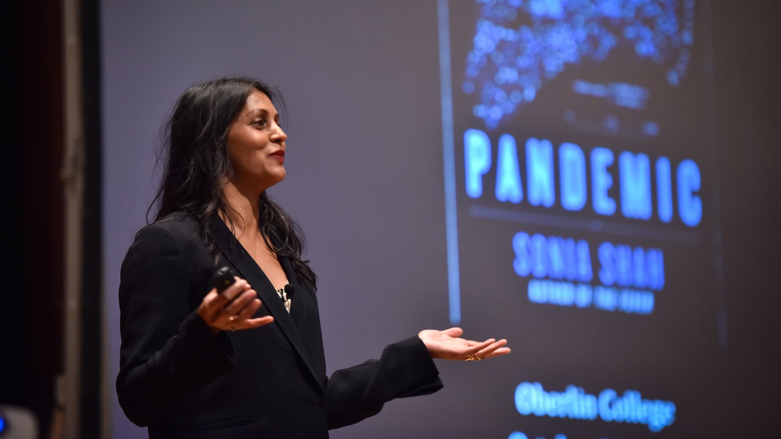 Sonia Shah giving a presentation.