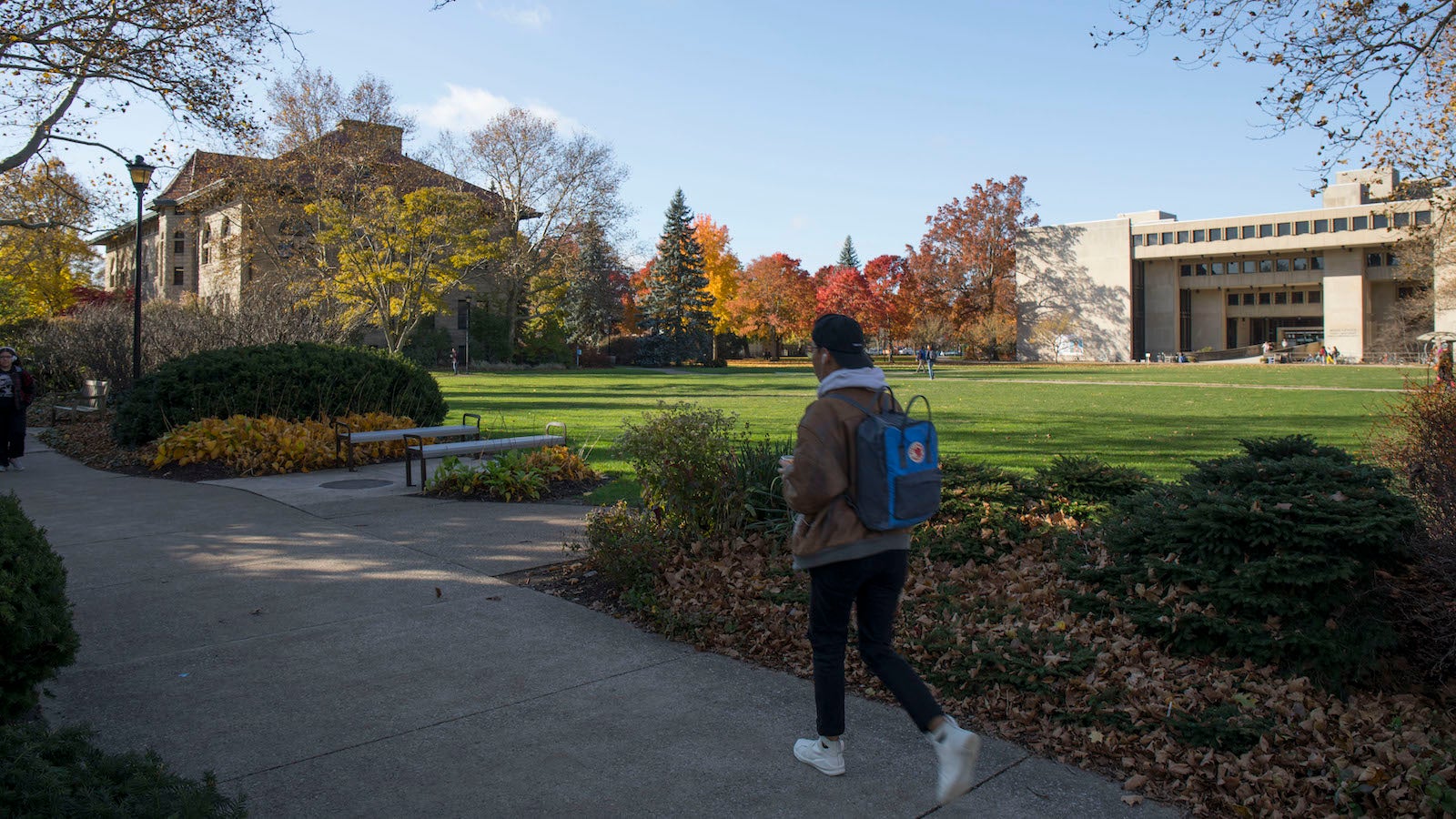 Students walking in Wilder Bowl on a sunny fall day.