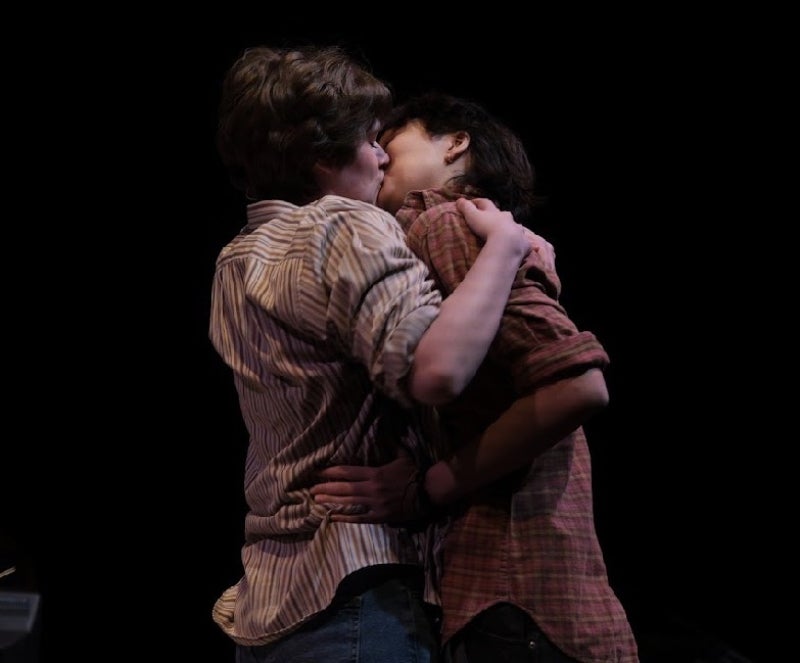 Medium Alison (Chase Perabo) and Joan (Sunny Scott) kissing passionately 