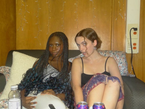 Me and my friend Zoe sitting on the couch in our quad room together.