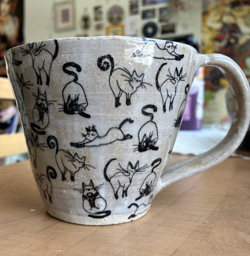 Mug with little cats on it