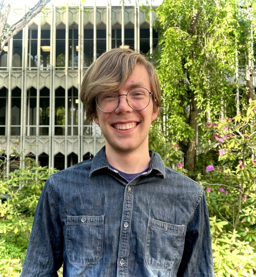 Marcus smiling outside