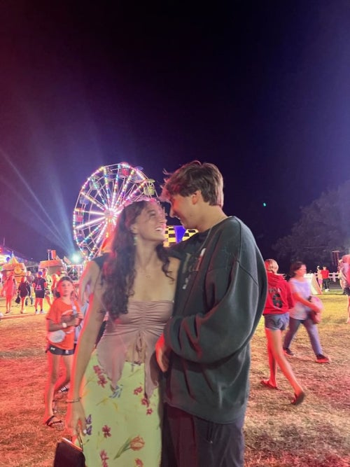 Will smiling down at Katie in front of carnival