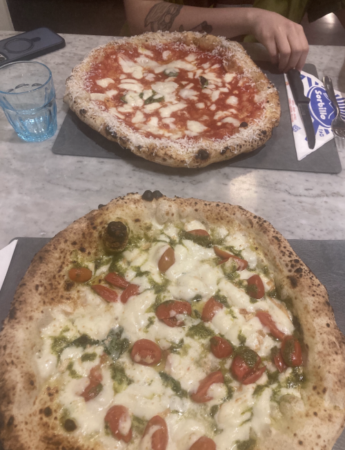 Two pizzas on a table