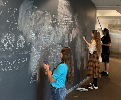 Zoe at chalkboard