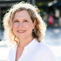 photo of woman wearing a white shirt with shoulder length blonde hair