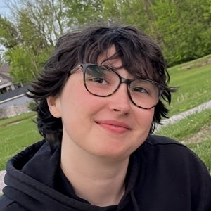 Profile picture of Ozzie, wearing a black sweatshirt and glasses.