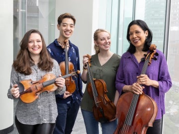 Juilliard String Quartet smiling.