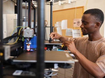 a student looks focused while working in an engineering lab