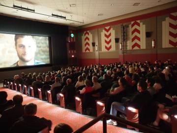 Audience watching a movie in the Apollo Theater
