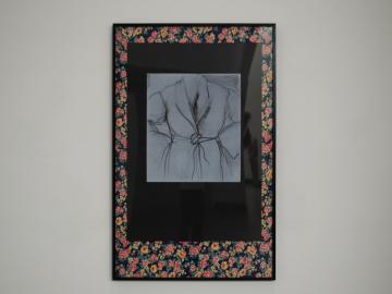 Framed fabric on display