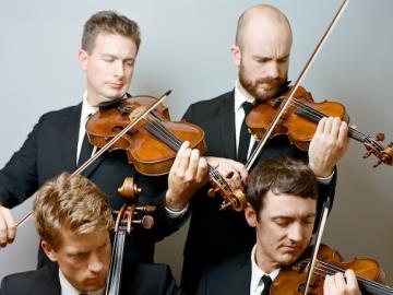 Calder Quartet playing violins