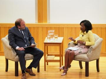 seated in chairs, from left, Pat DeWine and Donica Varner