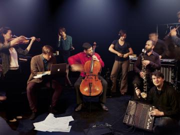 The 10 members with their instruments