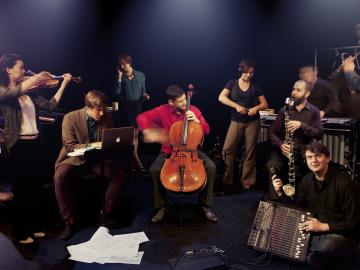 The 10 members with their instruments