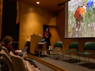 Picture of woman presenting slideshow