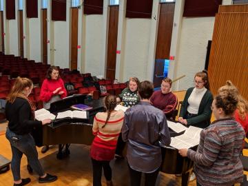 Oberlin College Student Olivia Fink leads a choir sectional in Warner Concert Hall