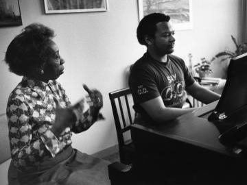 Frances Walker works with a piano student