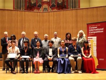 Cooper Competition Judges, Participants and Thomas and Evon Cooper on Warner Concert Hall stage