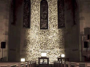 Photo of a light projection on a chapel wall