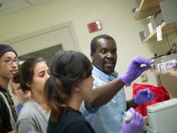 Students and a professor in a lab