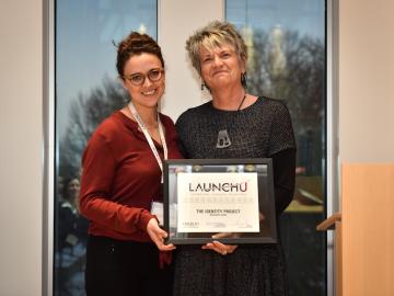 Director of Entrepreneurship Elyzabeth Holford and Alesandra Zsiba ’10 with LaunchU award