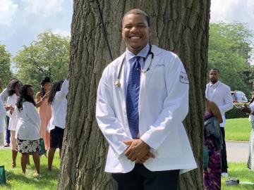 Portrait of first-year medical student Lawrence Hamilton in white lab coat.