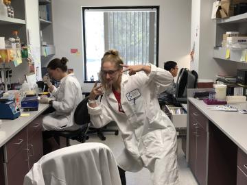 McLean Sammon ’19 standing in a lab.