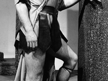 Tony Musante as Hector. Black & white photo.