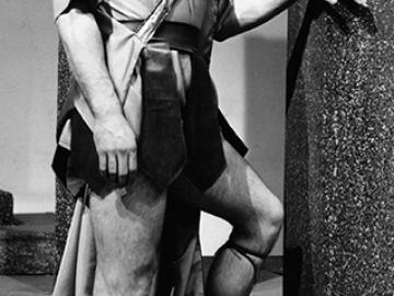 Tony Musante as Hector. Black & white photo.