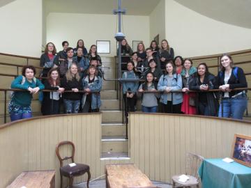 group poses during a visit to the Old Operating Theater and Herb Garret in London