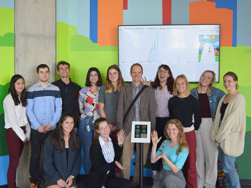The Oberlin College Environmental Dashboard team in front of the now interactive Cleveland Environmental Dashboard Exhibit.