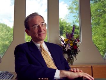 Robert Dodson, seated in the office of the dean.