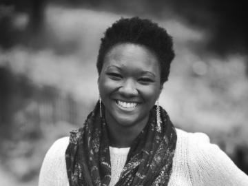 A woman standing with her hand on her hip