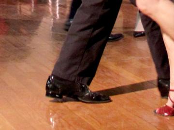 view of feet of two people dancing 