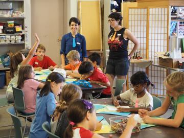 Elementary school students engage in hands-on activities.