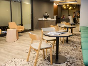 Photo of a room with chairs, couches, and tables