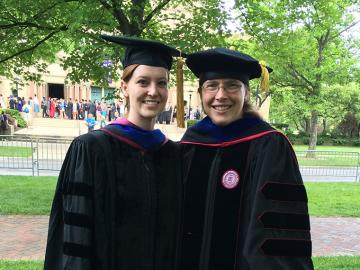 two women dressed in regalia at Oberlin Commencement 