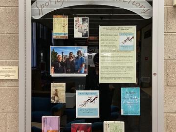 A library display case of the Sato book donation.
