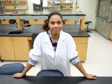 Kaitlyn Rivers standing in her biology lab.