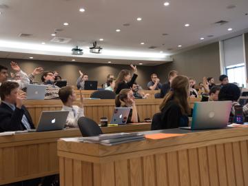 students in a classroom with laptops